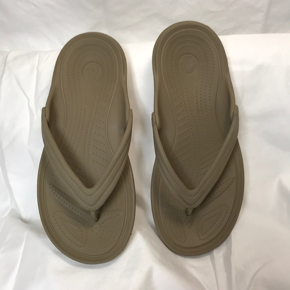 CROCS.  8 Women’s; 6 Men’s.  Flip-flops.